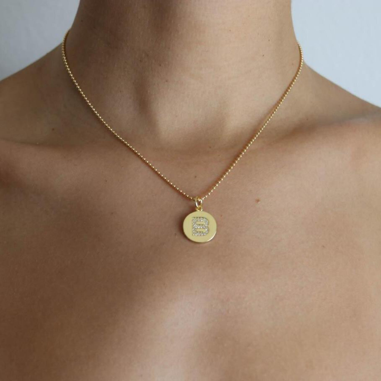 THE INITIAL COIN CHARM
